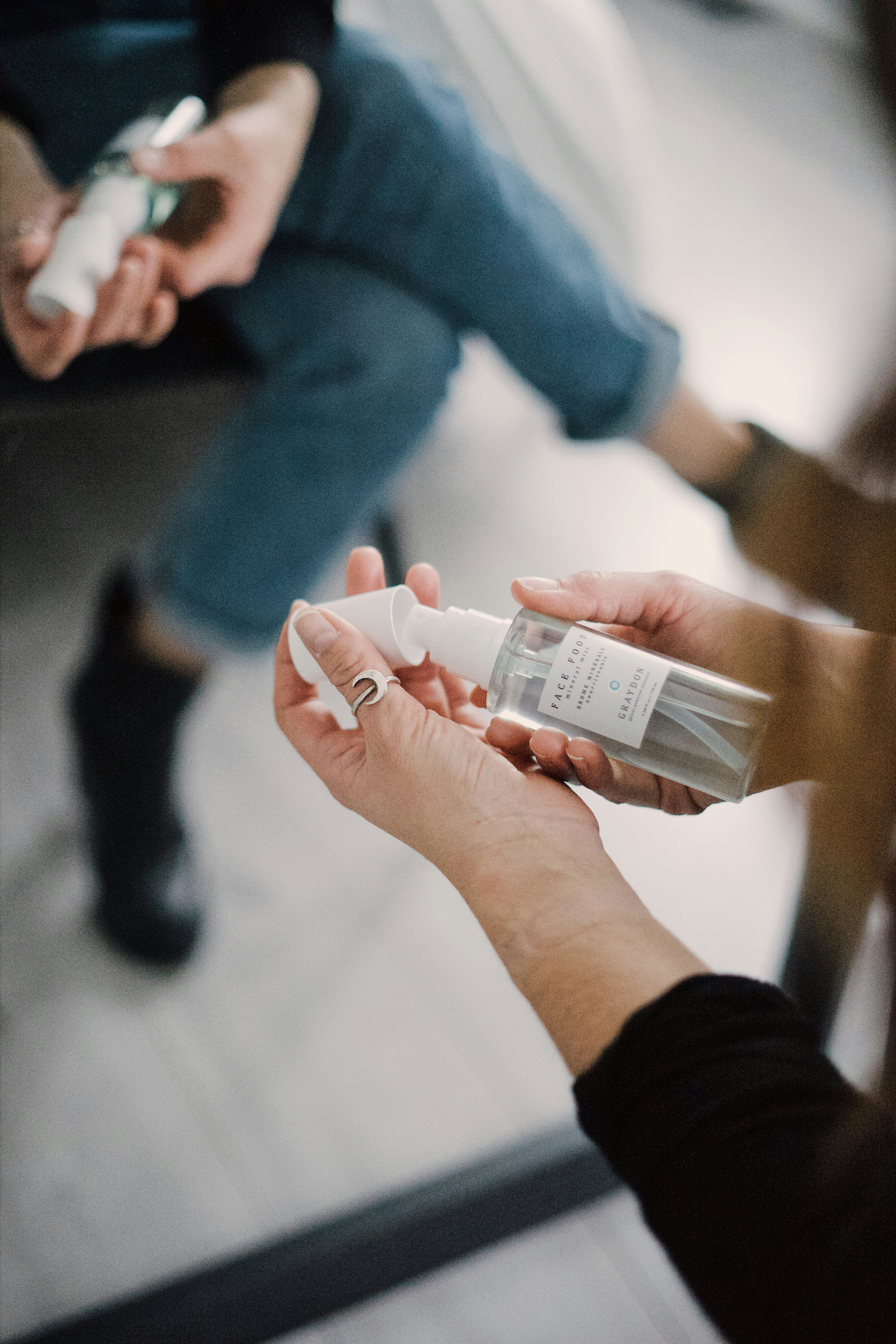 person holding white plastic bottle